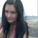 An attractive brunette woman takes a huge shit in an outdoor setting. About a minute.